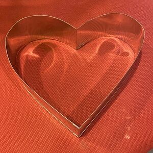 Aluminum heart shaped mold about 10 inches across.